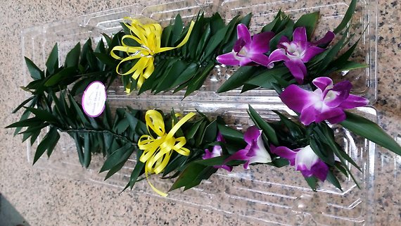 Best wishes (T leaves with orchids and ribbon) lei